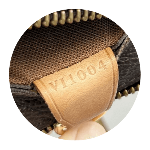 Close up of a leather tag with a Louis Vuitton code