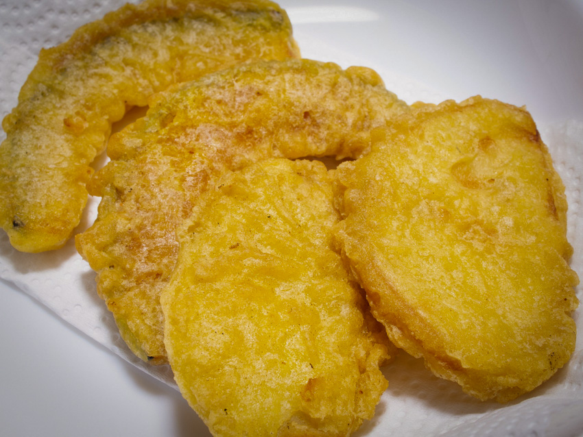 Close up of satsumaimo (sweet potato) tempura on a plate.