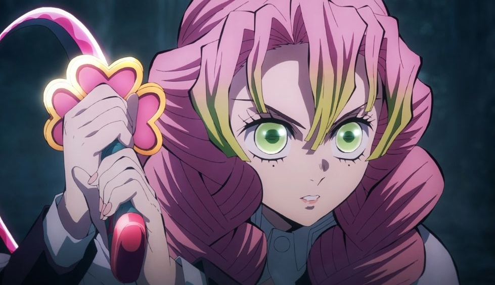Anime character with green eyes and pink hair holding a sword