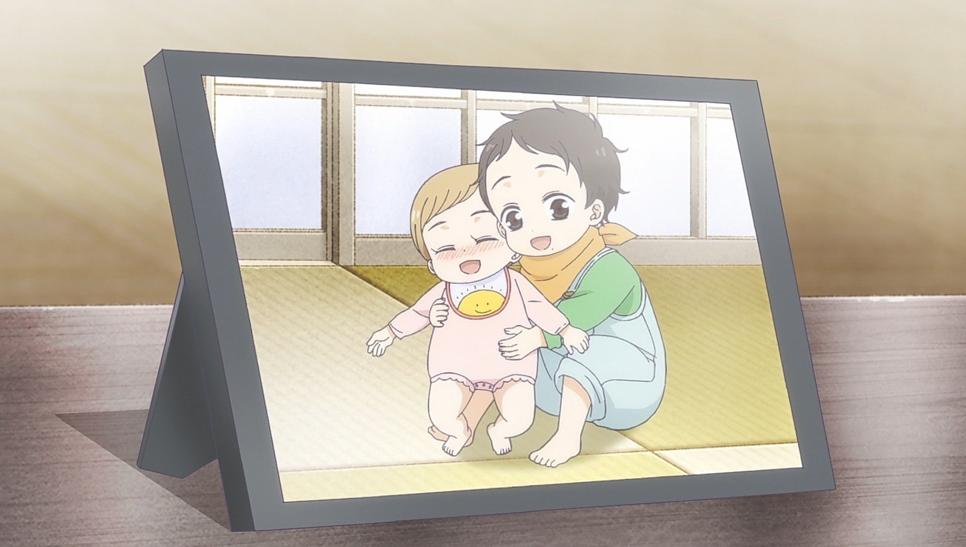 A picture in a frame of Hirari and Hinata, both characters of Tadaima, Okaeri animation