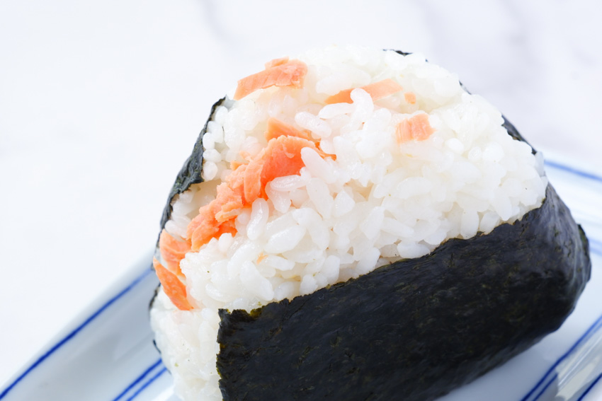 Finished onigiri with the nori wrapped leaving the top uncovered