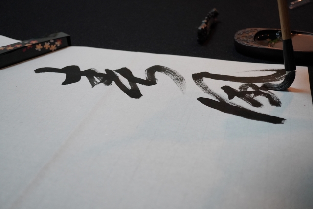Close up of a Japanese calligraphy brush on paper 
