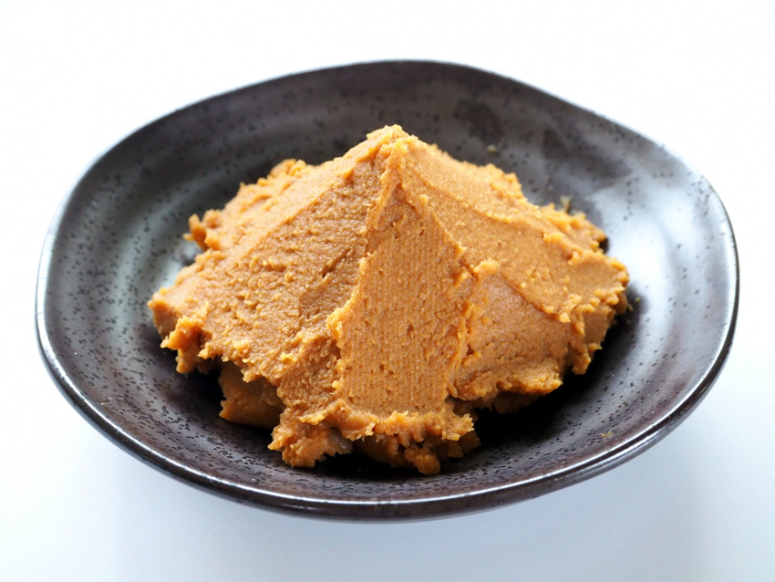 A small plate with miso paste on it