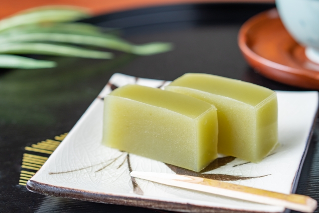 Two slices of green tea–flavored yokan served on a ceramic plate