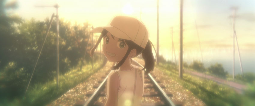 Karen walking on the train tracks towards the sun.