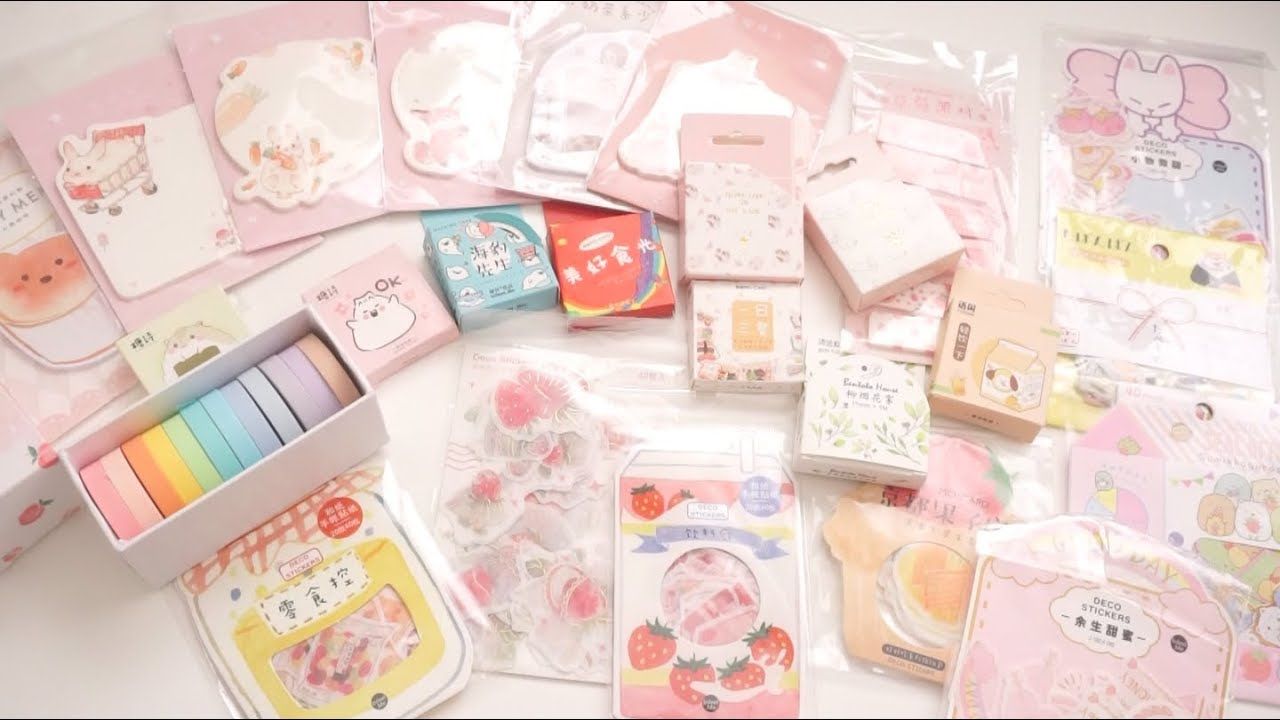 Various stationary items in cute designs, such as sticky notes, tape and papers