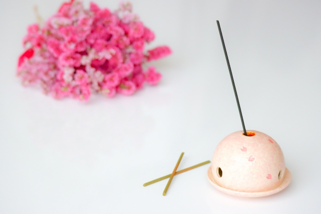 Incense hold in a dome shape with an incense inside it