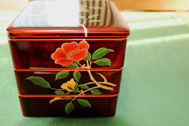 Square shaped three level Japanese lacquerware box with flower decorations