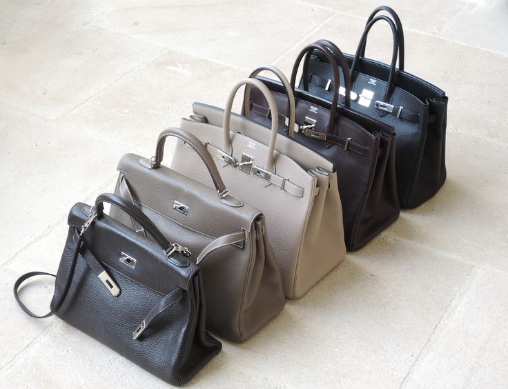 Hermes bags lined up on the floor