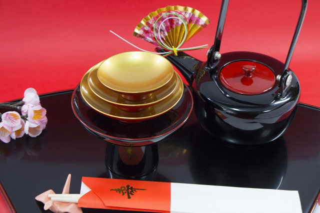 Lacquerware set of bowls and saucers used to drink sake from at ceremonies.