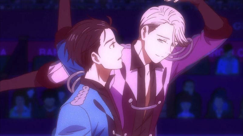 Waist-up scene of Yuri and Victor skating on the ice with the audience in the dark background.