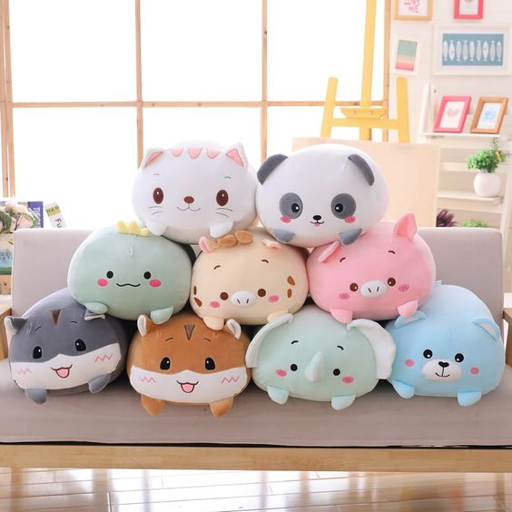 An assortment of different plushies on top of each other 