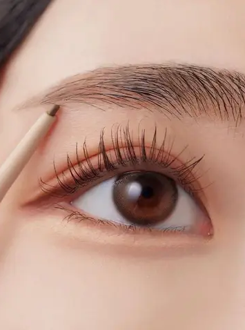 Close up of woman's eye with softly curved eyebrows
