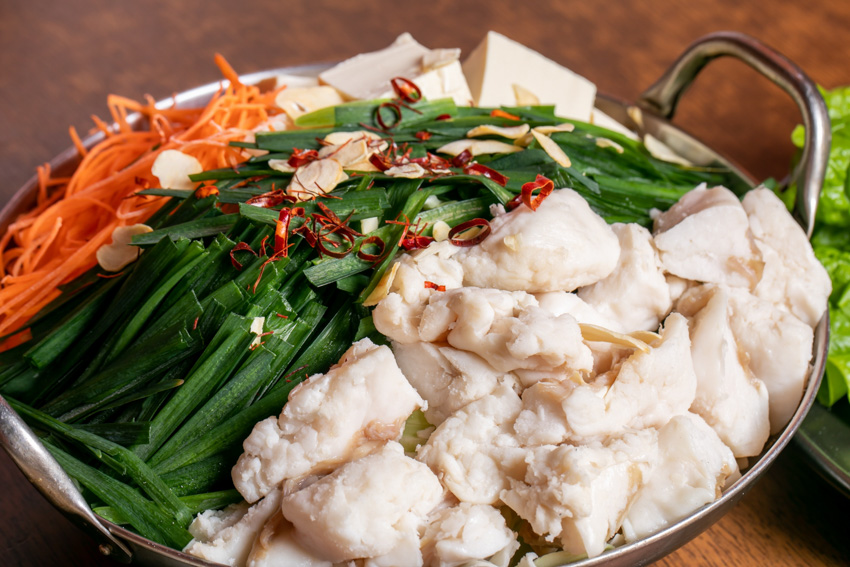 Motsunabe pot filled up with vegetables, meat and spices