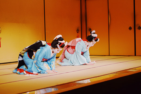 Two Maiko, apprentices of Geisha, performing on stage
