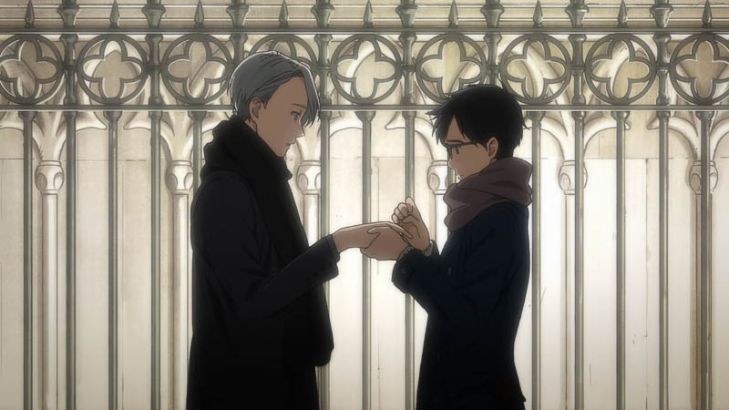 Victor and Yuri in front of a building in an expensive looking neighborhood at night, exchanging rings.