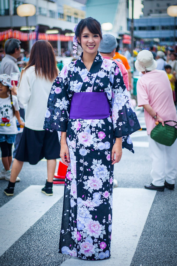 Japanese woman wearing a yukata at a local summer festival