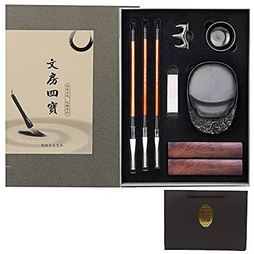 A calligraphy set with brushes, inkstone, paper and other accessories.