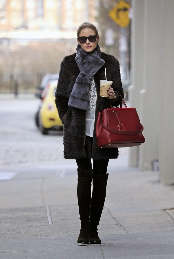 Celebrity Olivia Palermo walking on the street hold a bag