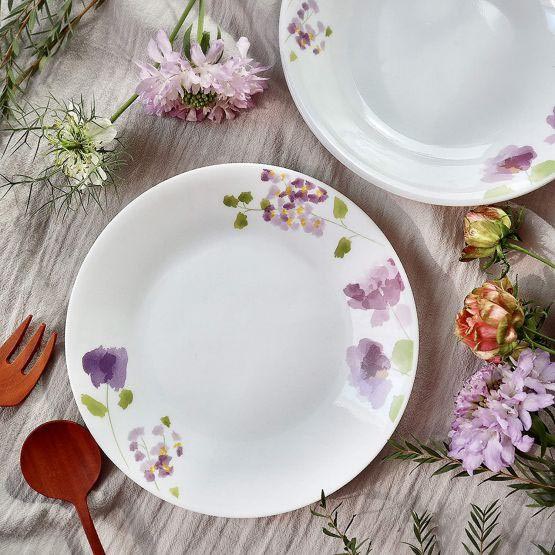 White chu-zara plates with purple flower decorations along the rim