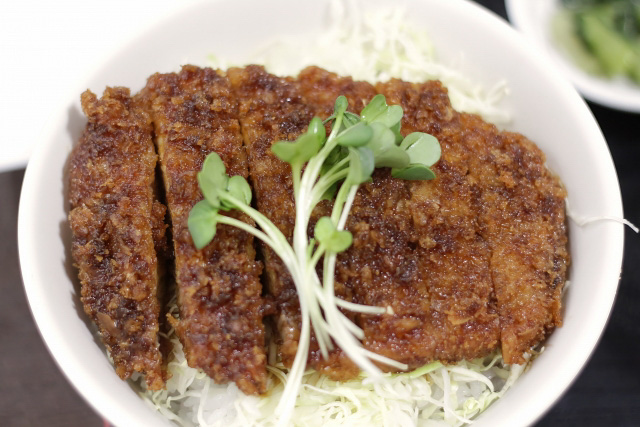 Close up of a  bowl of Katsudon