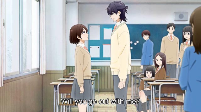 Hananoi and Hotaru standing face to face in a classroom with other students looking at them.