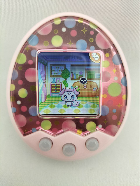 Close up of a tamagochi with a modern color LCD screen