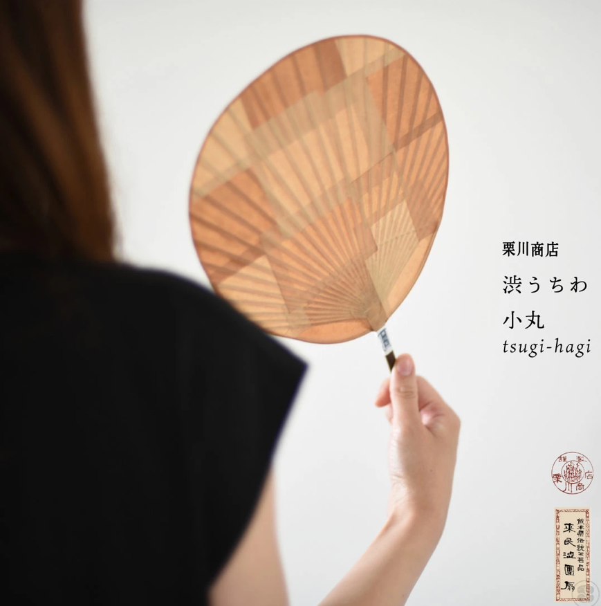 Woman hold an uchiwa, a Japanese type of fan