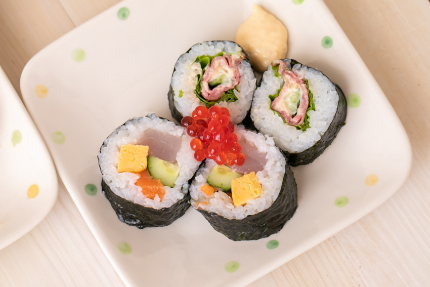 Pieces of sliced sushi roll on a plate