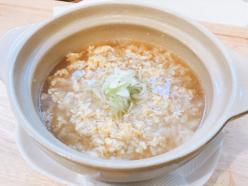 Pot with zosui - rice mixed with the remaining broth from the nabe