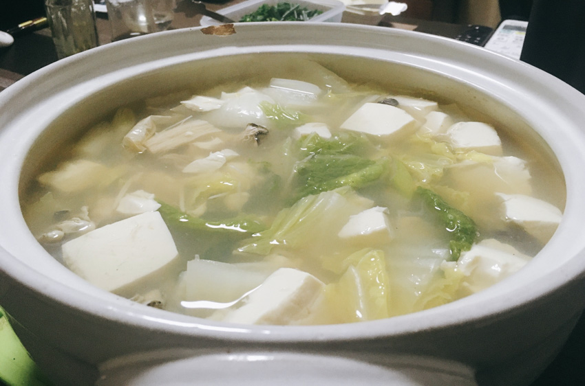 Yudofu pot filled with tofu.