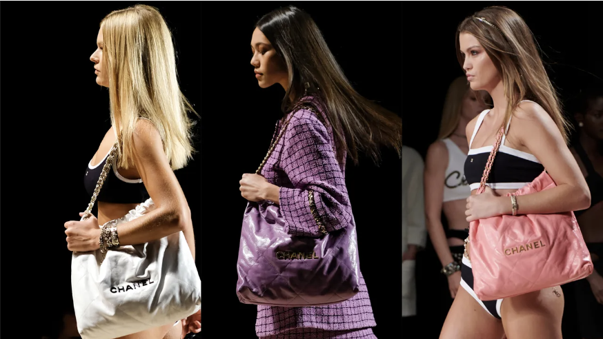 Three models wearing the Chanel 22 bag in different colors