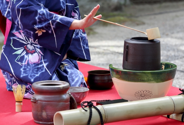 Woman in traditional tea ceremony with Matcha