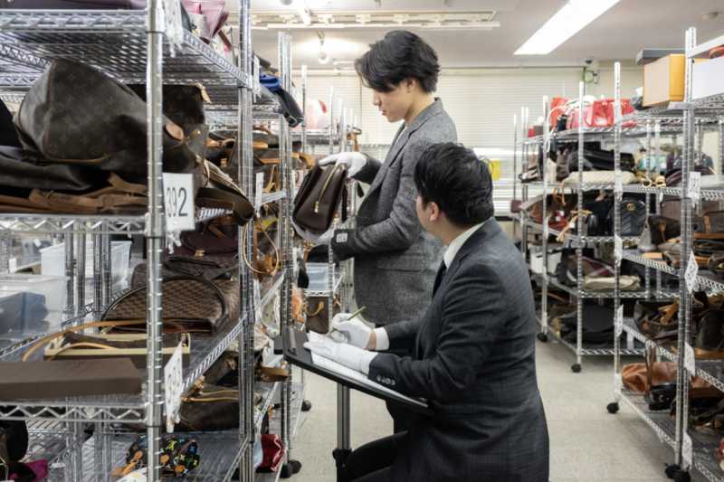 Detailed luxury item inspection and grading system at a Japanese resale auction house