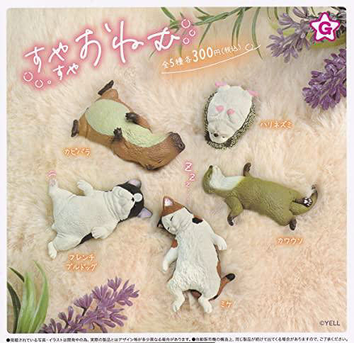 Five Gacha Gacha animal figures laying on their backs sleeping