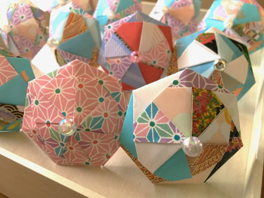 Origami umbrellas laid out on a table