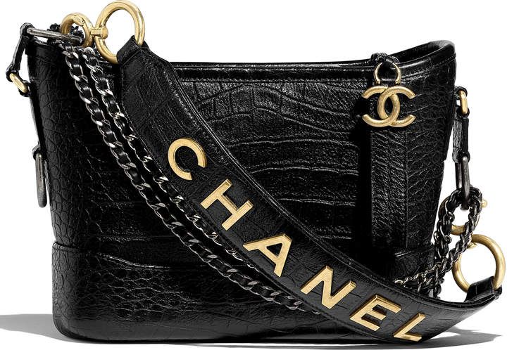 Chanel's Gabrielle bag in crocodile leather with an additional strap price with the Chanel brand on it