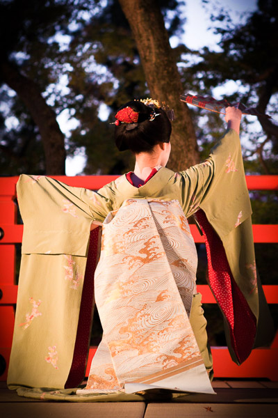 A Geisha dancing on a stage