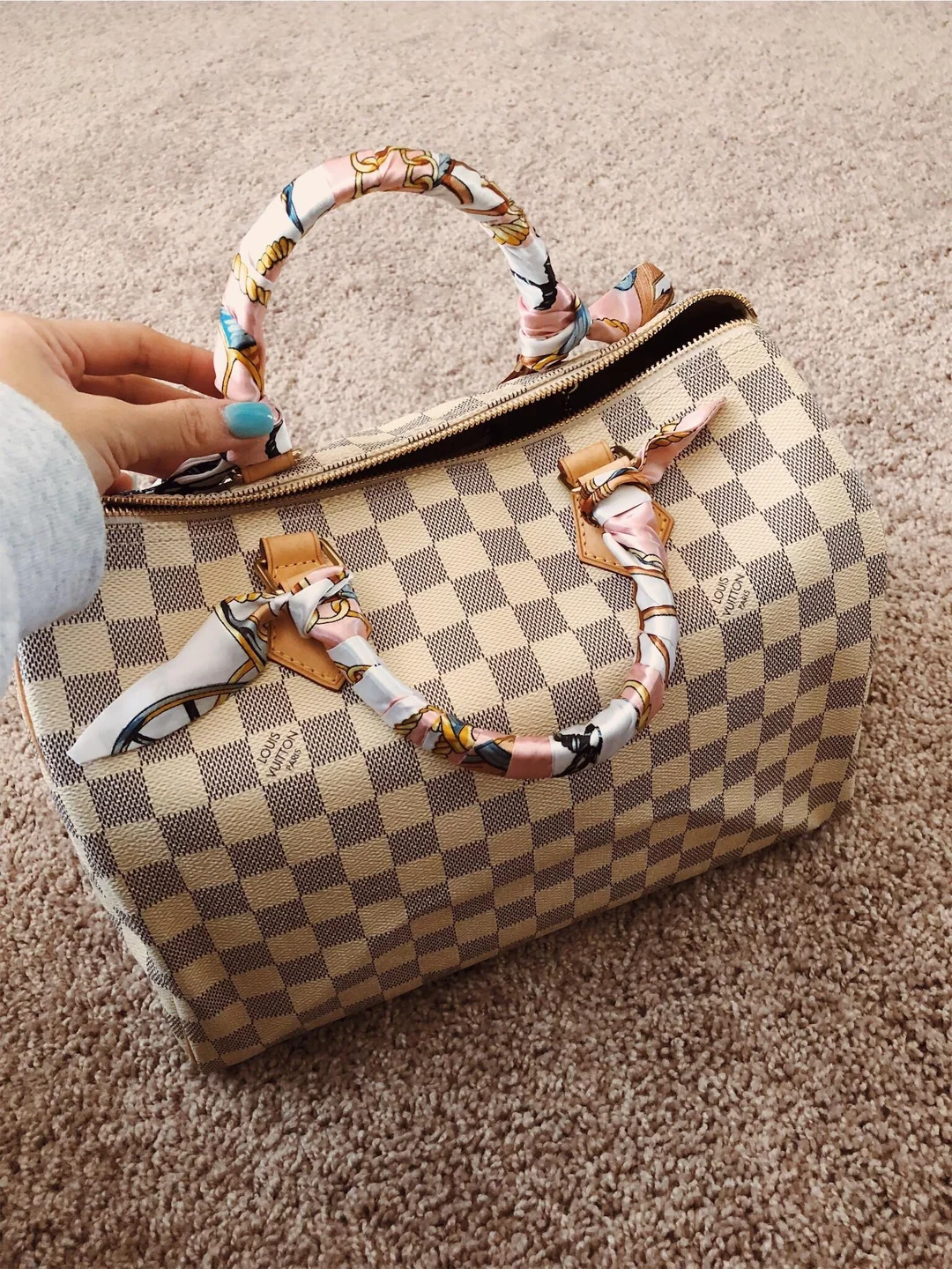 Louis Vuitton Speedy in Damier Azur with a scarf on its handles