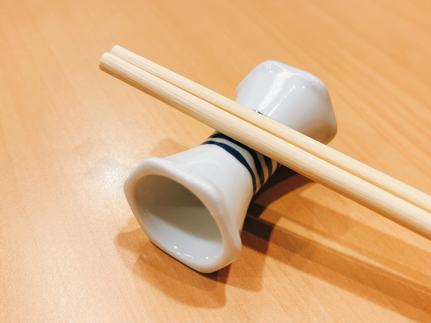 Chopsticks resting on a hashi oki