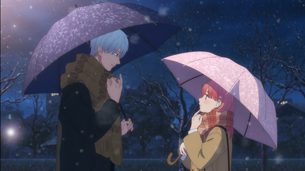 Itsuomi and Yuki doing sign language, standing outside facing each other with umbrellas at night with the snow falling.