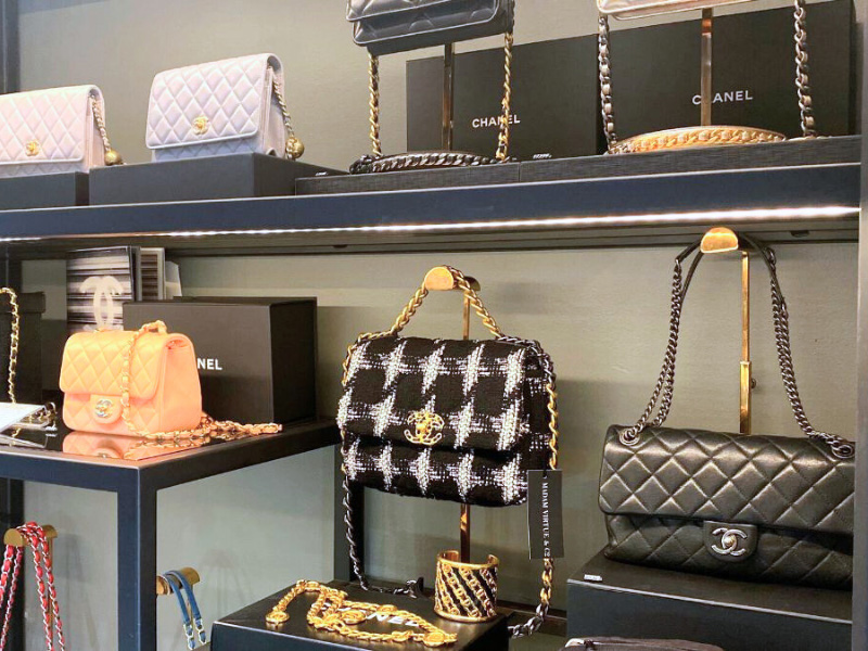Chanel bags on shelves in store display