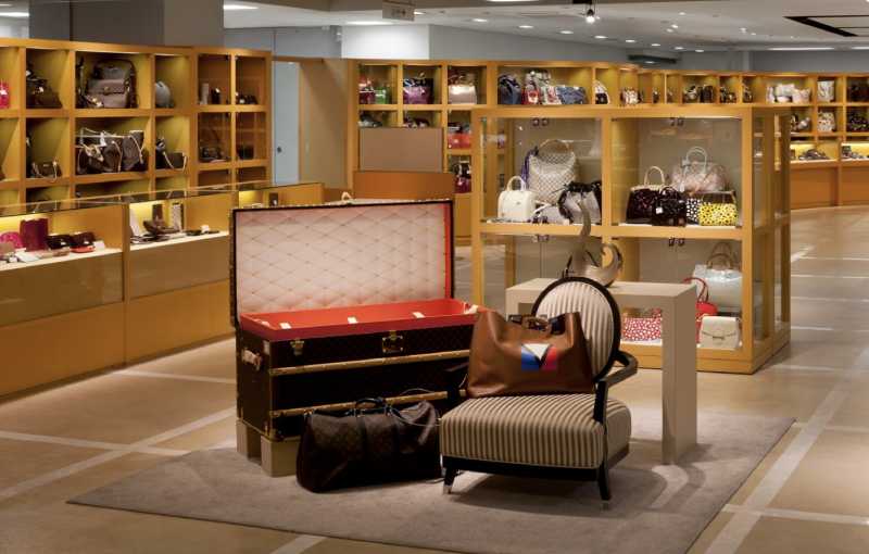 Japanese luxury resale boutique displaying designer handbags with meticulous organization and retail-level presentation