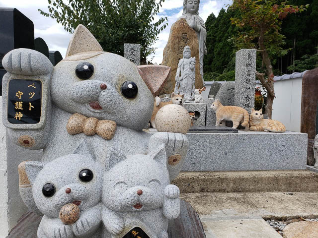 Three large pet statues made of stone