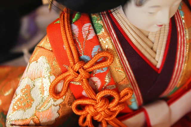 Close up of the shoulder part of a Japanese doll