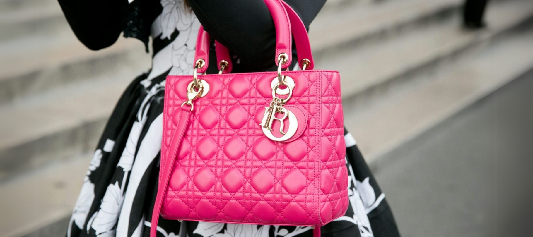 Lady Dior bag in bright pink being carried