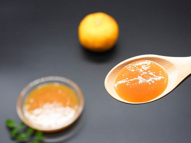 Close up spoon filled with Yuzu fruit paste