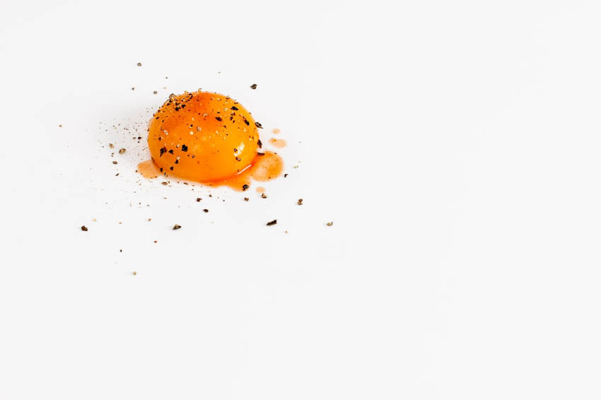 Egg yolk with pepper on it.