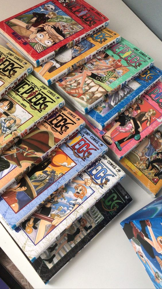 A collection of different One Piece manga books lined up