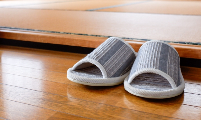 A pair of slippers on a wooden floor